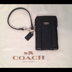 Black patent wristlet/phone case by Coach.
